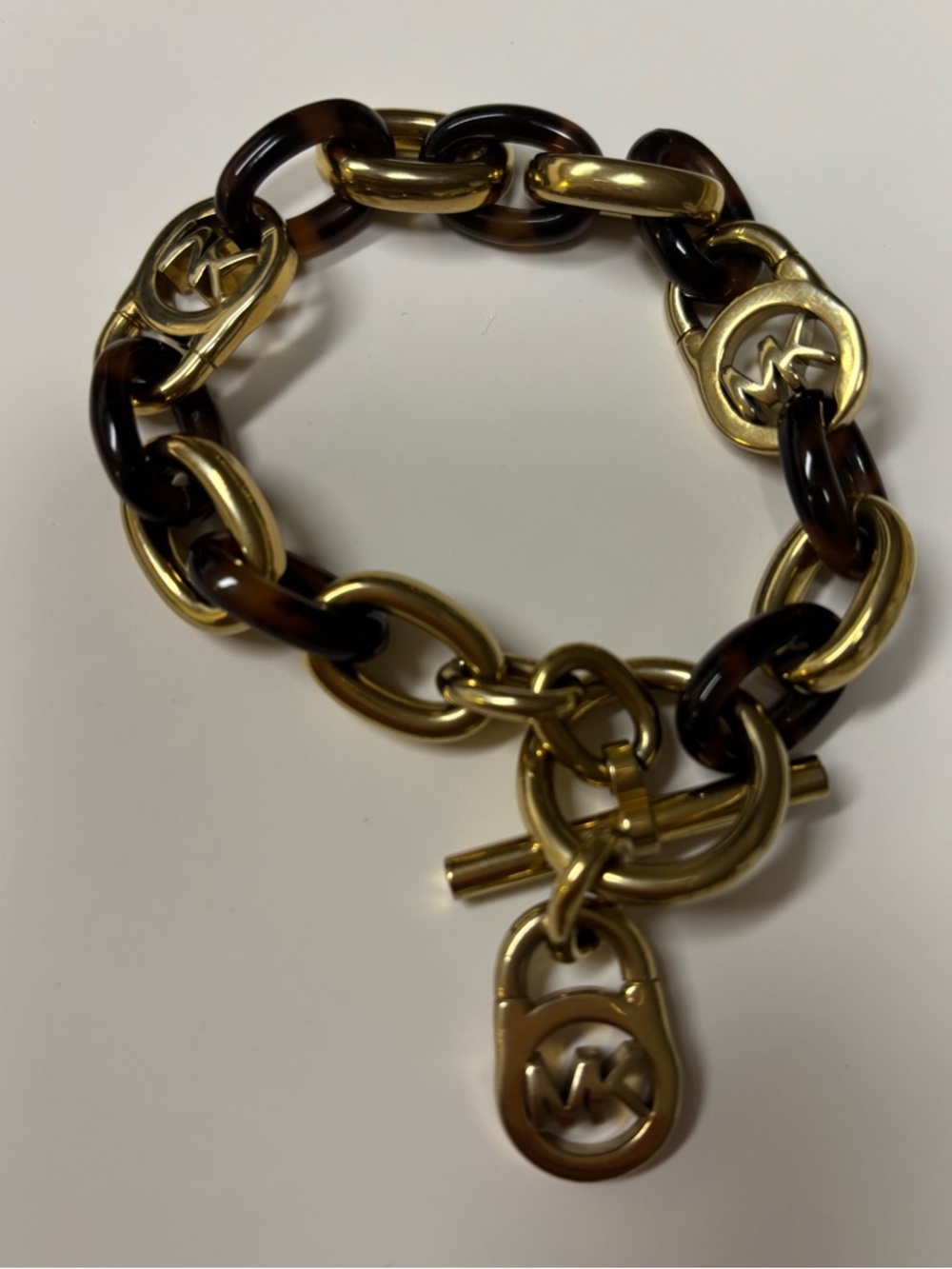 Michael Kors gold tone and tortoise-look toggle bracelet
